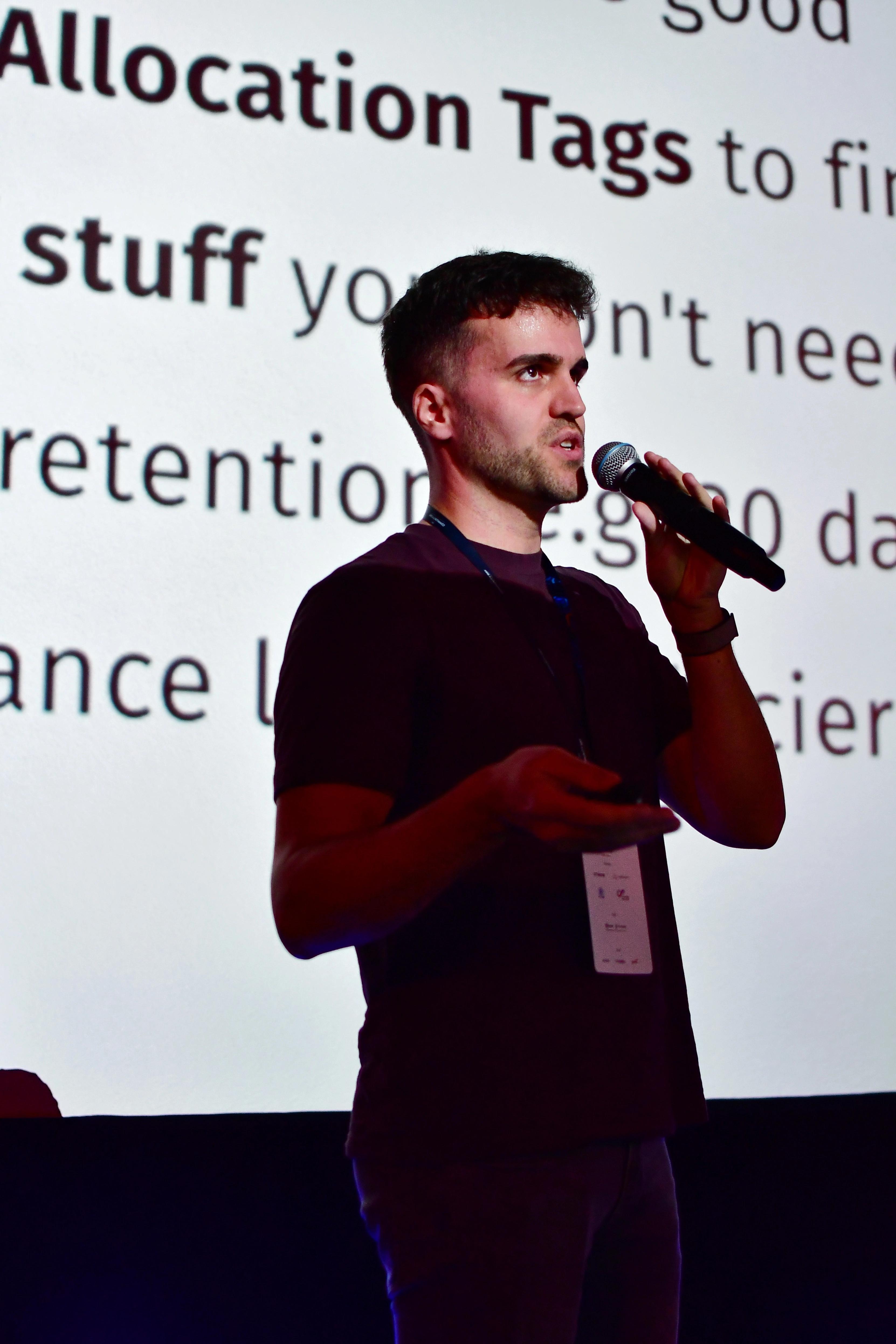 Tobias Schmidt speaking at AWS Community Day Warsaw 2025